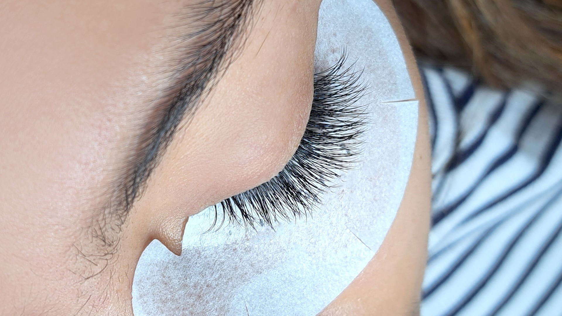 Close up of eye with eyelash extensions ,beauty salon treatment ,2d volume, 3d volume, classical lashes,Russian volume,megavolume, new set